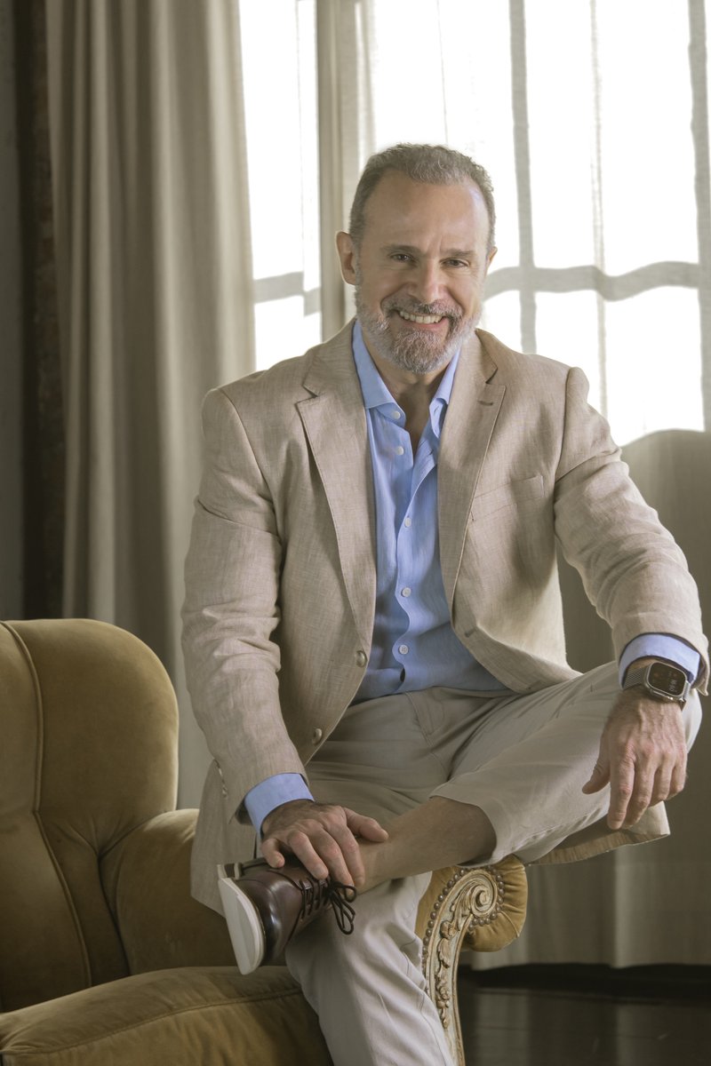 Mario Gastaldi in an elegant armchair